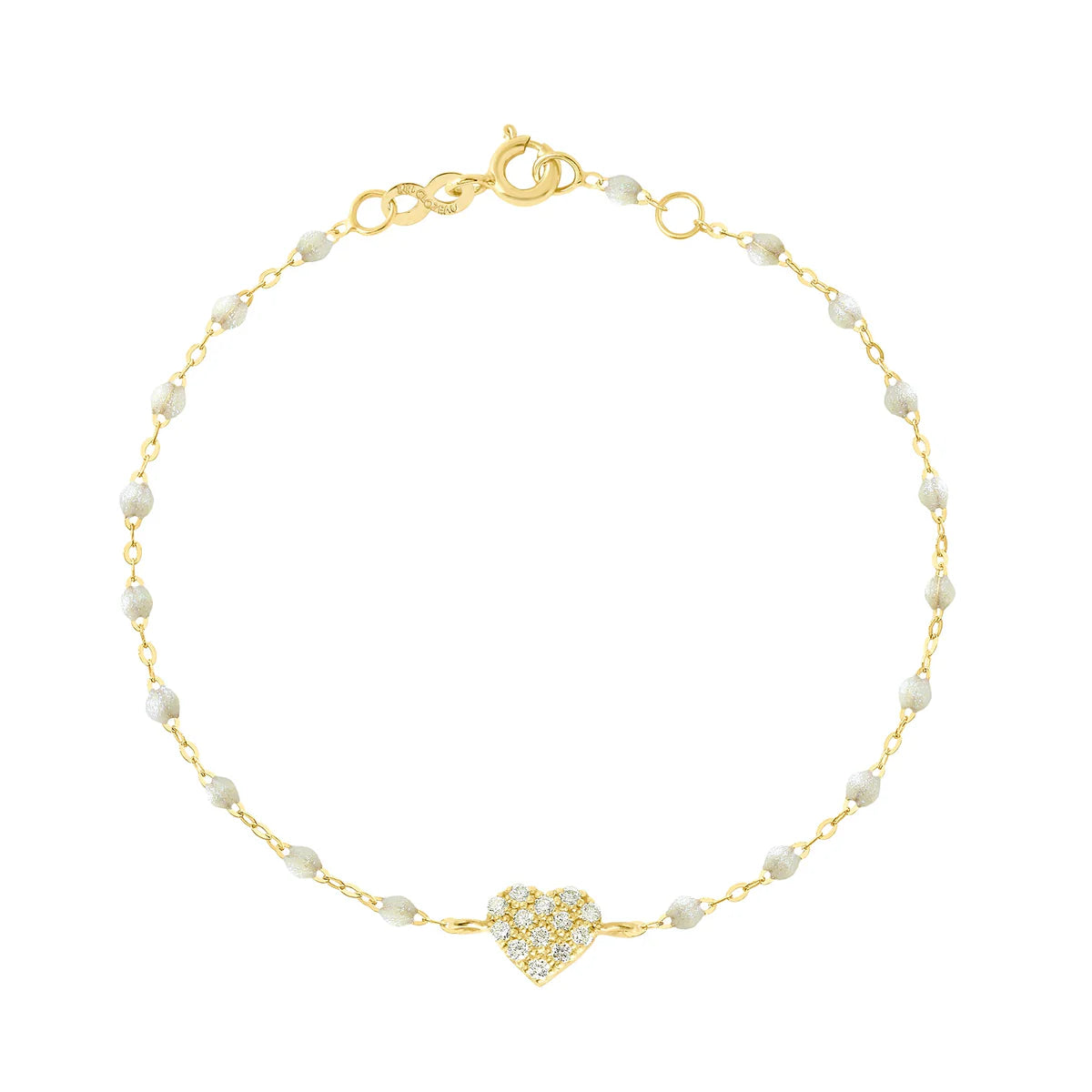The In Love Diamond Bracelet 6.7" by Gigi Clozeau features a gold chain with small black resin pearls and a central heart pendant adorned with clear stones, crafted in 18k yellow gold, shown on a white background.