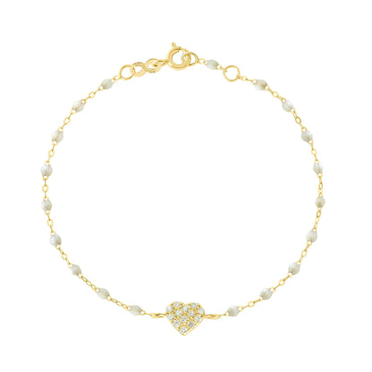 The In Love Diamond Bracelet 6.7" by Gigi Clozeau features a gold chain with small black resin pearls and a central heart pendant adorned with clear stones, crafted in 18k yellow gold, shown on a white background.