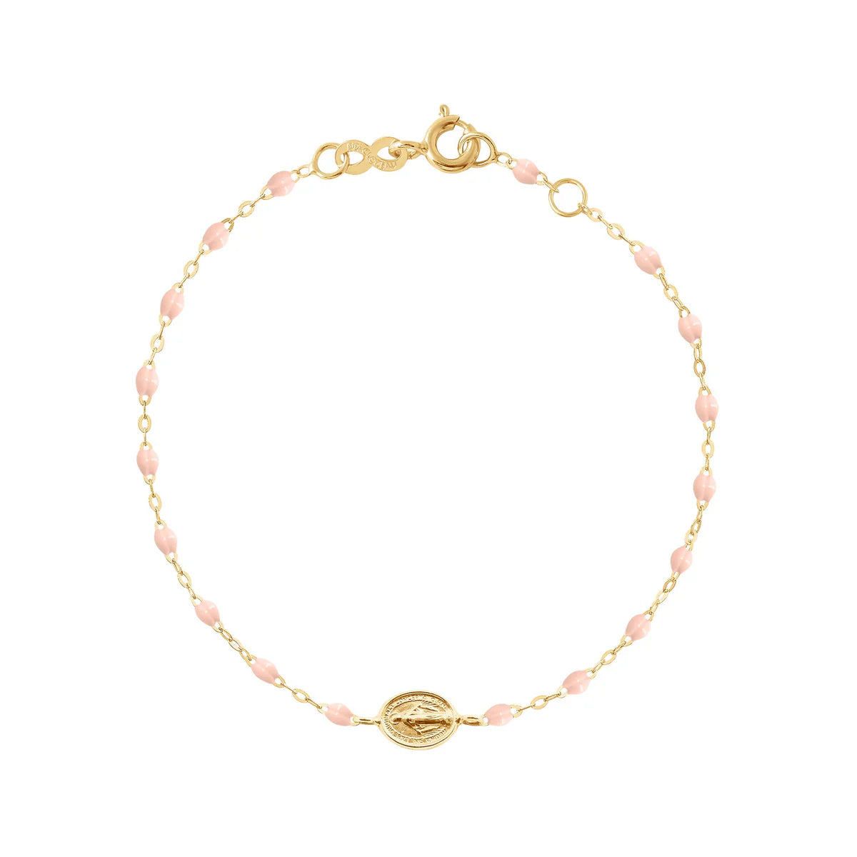 The Gigi Clozeau Madone Charm Bracelet 6.7" is crafted in 18k gold with small pink beads, an oval charm centerpiece, and a secure lobster clasp.