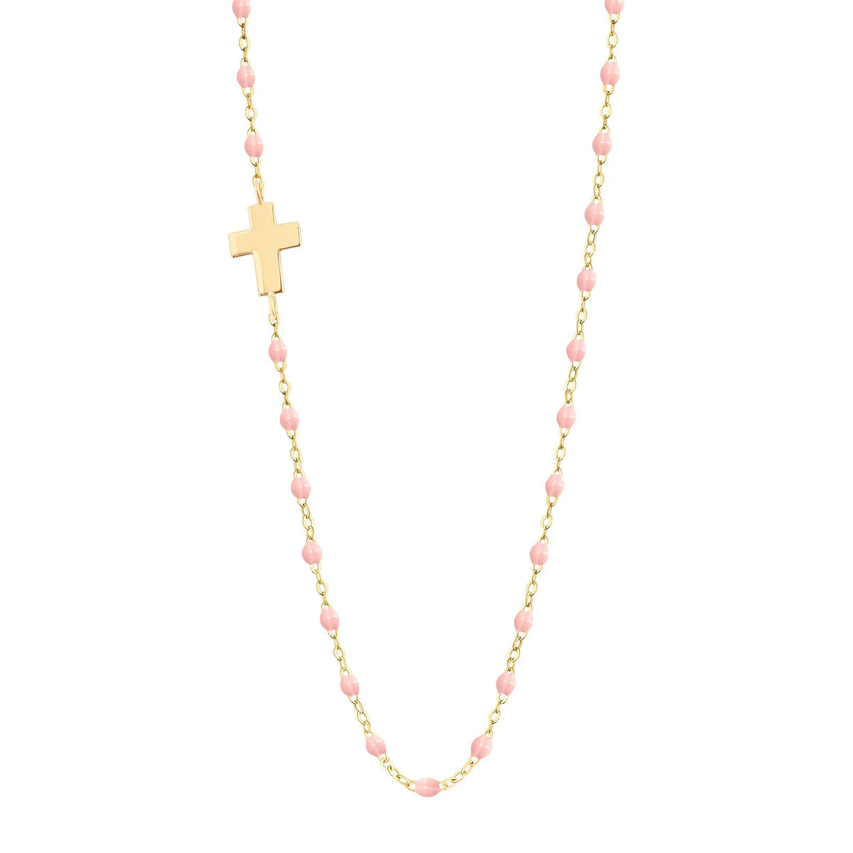 Gold chain necklace featuring small pink resin pearls and an off-center cross. Inspired by the Gigi Clozeau Side Cross Necklace 16.5".