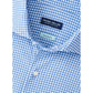 Close-up of a blue and white gingham Peter Millar Excursionist Flex Sport Shirt featuring an "ExactaLuxe Flex" tag near the collar.