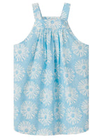 The Girls' Plum Dress by Love Brand is a sleeveless blue beach party dress with a white floral pattern, gathered neckline, and wide shoulder straps, crafted from soft organic cotton.