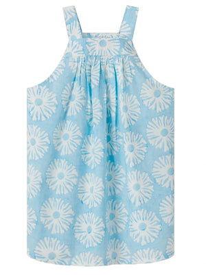 The Girls' Plum Dress by Love Brand is a sleeveless blue beach party dress with a white floral pattern, gathered neckline, and wide shoulder straps, crafted from soft organic cotton.