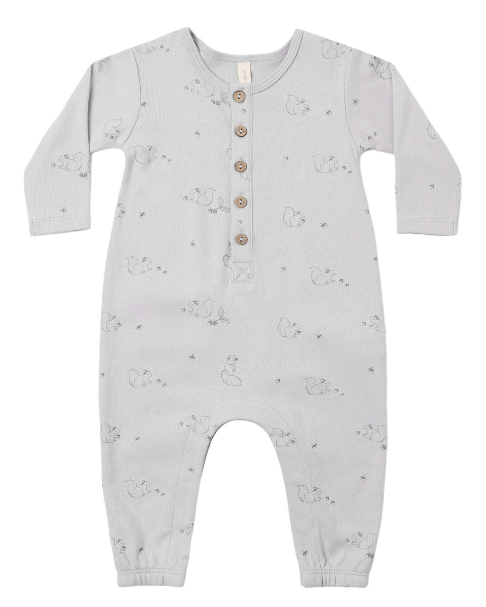 The Quincy Mae Baby Boys’ Long Sleeve Jumpsuit features a light gray color, front coconut buttons, inseam snaps for easy changing, and a subtle animal pattern printed throughout.