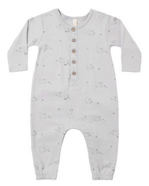 The Quincy Mae Baby Boys’ Long Sleeve Jumpsuit features a light gray color, front coconut buttons, inseam snaps for easy changing, and a subtle animal pattern printed throughout.