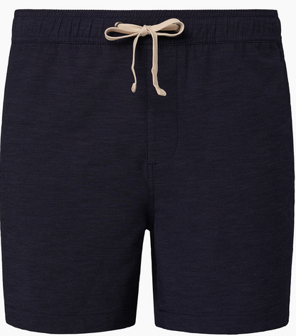 The Onia Land to Water Short 6" in dark navy features an elastic waistband, beige drawstring, and four-way stretch fabric, displayed against a plain white background.