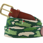 The Smathers & Branson Golfer's Camo Belt features a rolled-up needlepoint design with a gold buckle and leather end, showcasing a golf-themed green and beige pattern with red flags, crafted from premium Italian leather.