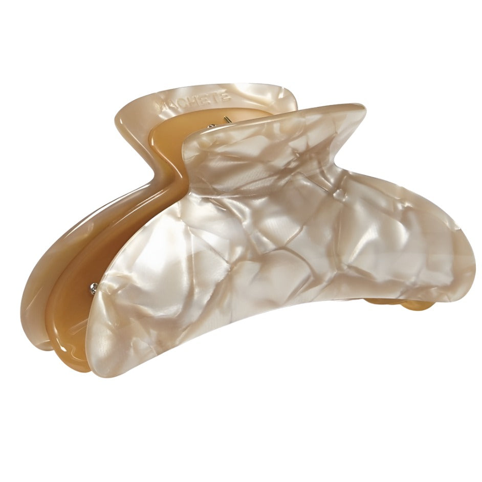 A translucent beige Machete Grande Heirloom Claw hair clip made from Italian acetate, designed in a crinkled, irregular shape with a glossy finish.