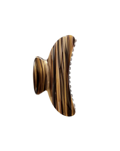 The Grande Heirloom Claw by Machete is a brown and black striped hair clip with a curved design and teeth, expertly crafted from Italian acetate—perfect for securing large volume or long, thick hair; shown isolated on a white background.