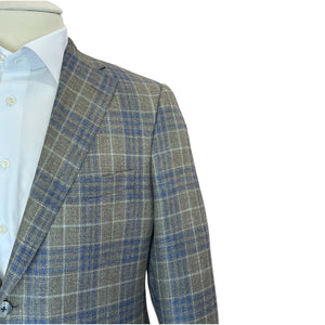 A close-up of a mannequin in the Samuelsohn Grand Green Blue Plaid Bennet Blazer, featuring blue and white lines over gray, paired with a light blue shirt to highlight the elegance and fit of luxury menswear against a white background.