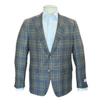 A mannequin showcases the Samuelsohn Grand Green Blue Plaid Bennet Blazer over a white dress shirt, with two buttons fastened and visible front pockets—a refined example of luxury menswear.