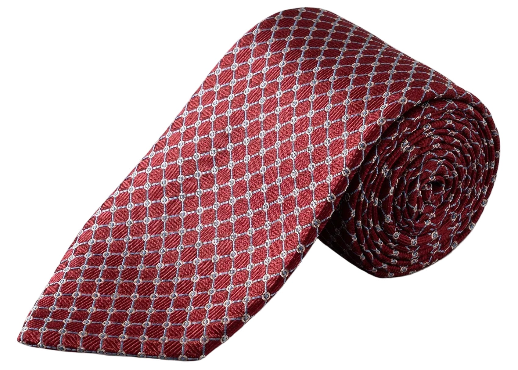 The Eton Geometric Woven Silk Tie is a rolled-up red jacquard accessory patterned with a repeating white micro geometric diamond motif, making it an ideal choice for formal occasions.