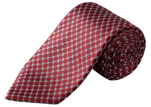 The Eton Geometric Woven Silk Tie is a rolled-up red jacquard accessory patterned with a repeating white micro geometric diamond motif, making it an ideal choice for formal occasions.