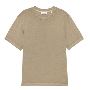 Beige Light Cotton Tee by Frame with short sleeves and a crewneck, laid flat on a white background. The interior collar label displays the brand name "Frame." Made from premium Supima cotton, this luxury basic tee provides exceptional softness and comfort.