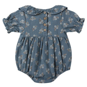 The Quincy Mae Baby Girls' Collared Romper features a floral print, puff sleeves, Peter Pan collar, ruffle details, and three wooden front buttons.