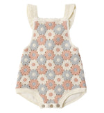 The Rylee & Cru Baby Girls' Crochet Romper features ruffled straps, vintage-inspired cream, pink, and gray circle patterns, is sleeveless, and has convenient snap closures at the bottom.