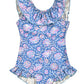 The Baby Girls' and Girls' Andrea Bathing Suit by Louise Misha is vintage-inspired with a blue and white floral pattern, sleeveless design, and charming ruffled neckline and hem, reminiscent of an elegant one-piece swimsuit.