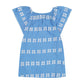 Light blue short-sleeve Girls’ Mini Capucine Caftan by Mer, adorned with white embroidered horizontal patterns and displayed flat against a white background. This lightweight cotton caftan features delicate embroidered detailing for effortless charm.
