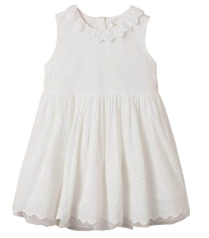 The Noralee Girls’ Georgia Dress is a sleeveless white mini dress featuring a ruffled neckline and delicate eyelet detailing along the hem, perfect for any special occasion, displayed on a plain background.