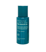 Barberino's Protective Ultra Gliding Pre-Shave Oil is a teal bottle with white text, suitable for all skin types. It softens and shields skin before shaving, ensuring smoother shaves and enhanced razor glide.