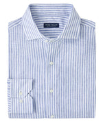 The Peter Millar Astino Lino Stripe Sport Shirt is a folded, long-sleeve Italian linen button-up with light blue and white stripes, front pocket, cutaway collar, and mother-of-pearl buttons.