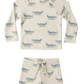The Rylee & Cru Baby Boys' Rashguard Set includes a cream-colored long-sleeve top and shorts with a green and blue alligator print.
