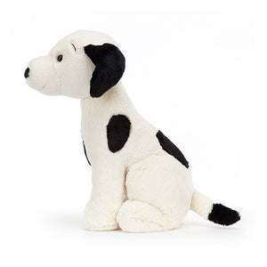 Jellycat Harper Pup, a black and white stuffed dog toy on a white background.