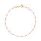 The Gigi Clozeau Classic Gigi Bracelet 6.7" from Gigi Clozeau showcases an exquisite gold chain made from 18-carat yellow gold, embellished with delicate pink beads and secured by a reliable clasp, achieving a perfect harmony of style and sophistication.