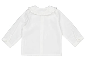 The Kidiwi Baby Girls' Hélena Blouse features navy embroidery, long sleeves, a ruffled Peter Pan collar, and buttoned cuffs, styled in off-white plumetis and shown flat on a white background.