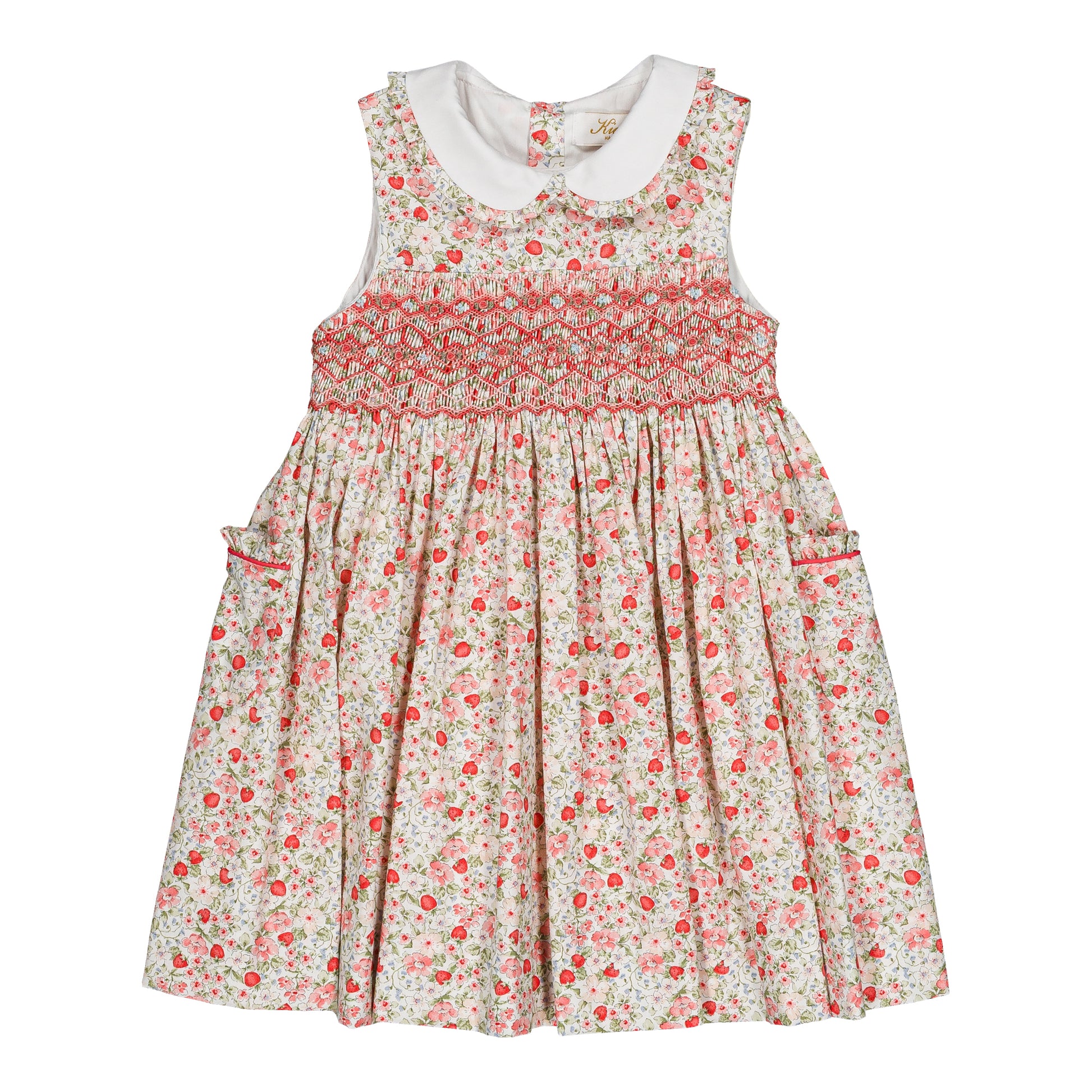 The Kidiwi Baby Girls' and Girls' Ixia Smocked Dress features a sleeveless cotton floral design in cherry red and green with a white Peter Pan collar, smocked bodice, and side pockets—ideal as a charming summer dress.