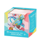 The Manhattan Toy Manhattan Ball Boxed is a multicolored infant toy with silicone shapes and a gentle rattle sound, shown in its branded packaging with product details visible.