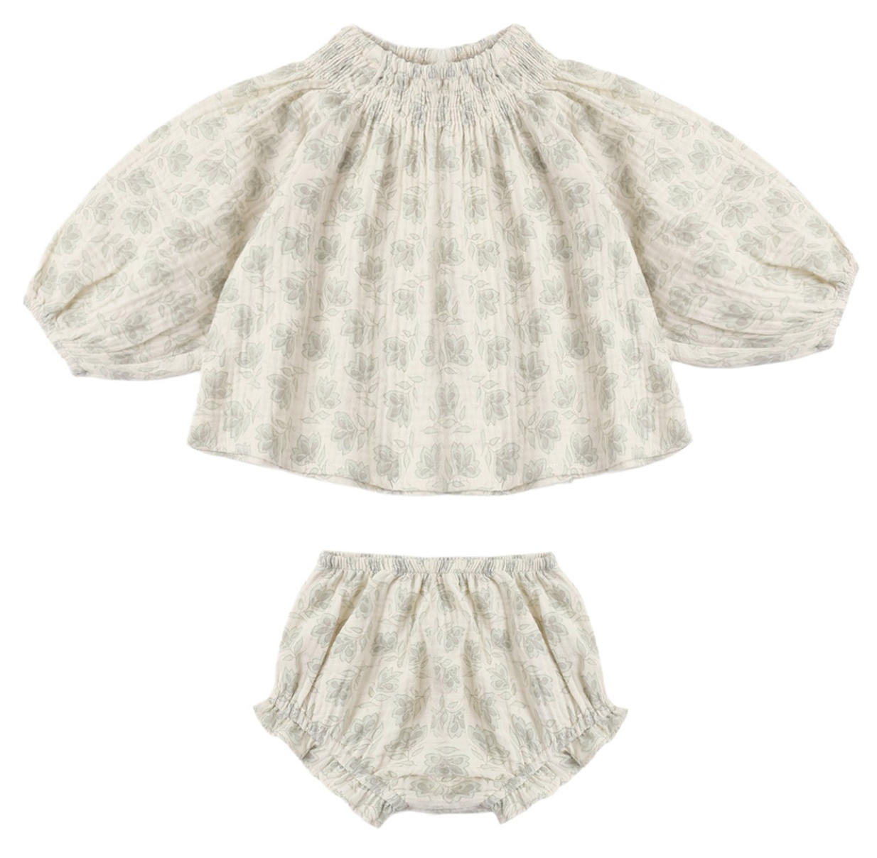 The Baby Girls’ Quincy Set from Rylee & Cru includes a long-sleeve blouse with elastic neck and cuffs, paired with a coordinating bloomer. Both pieces feature a light grey floral print on an off-white background for a timeless, delicate style.