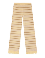 The Western Stripe Pant by Guest in Residence features beige and light brown stripes, flared legs, and Western fringe detail in a wool-cashmere knit, shown flat on white.