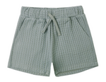 The Boys' Relaxed Short by Rylee & Cru features a light green color, soft fabric, elastic waistband with adjustable drawstring, and two side pockets, shown on a white background.