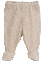 Serendipity Newborn Rib Pants with Feet, crafted from soft beige organic cotton, are designed for newborns and showcased on a plain white background.