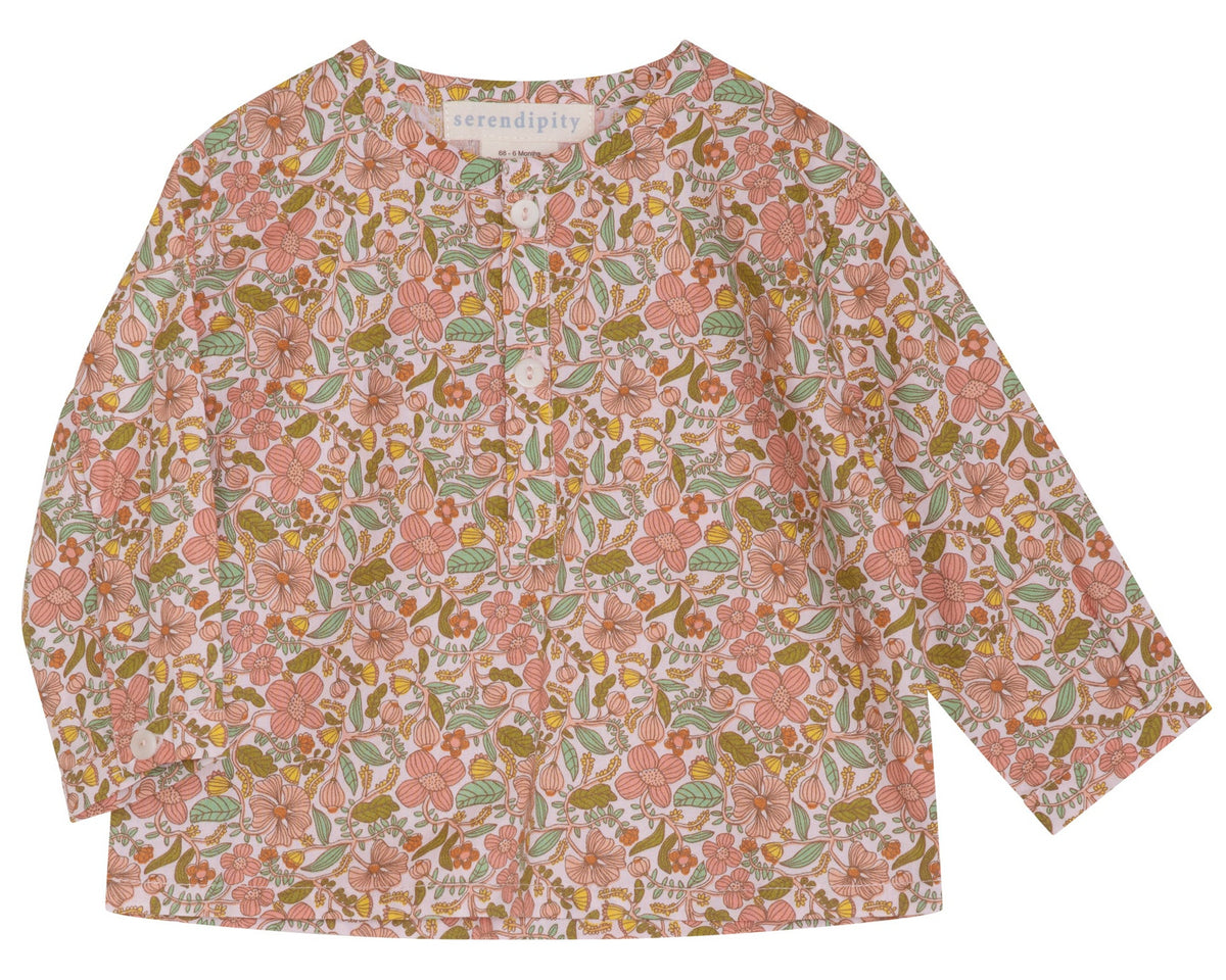 The Baby Light Woven Peasant Shirt by Serendipity is a long-sleeved children’s shirt made from GOTS certified organic cotton, featuring a pink, green, and brown floral pattern, two tagua nut buttons at the front, and a round neckline.