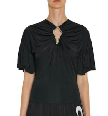 Woman wearing the Lanvin Summer Top with Eyelet Detail, a black short-sleeve viscose jersey top featuring pleated sleeves and an eyelet accent at the gathered neckline.