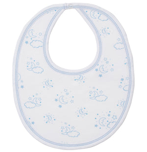 The Kissy Kissy Cheerful Good Night Printed Bib is a white Pima cotton baby bib with blue trim, featuring a playful print of blue moons, stars, and clouds.