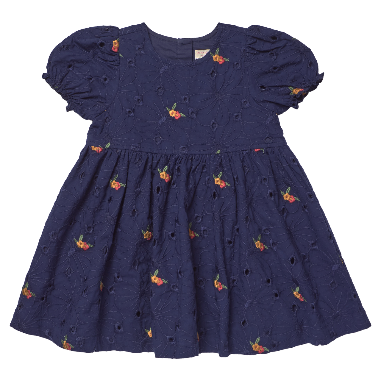 The Girls' Eliza Eyelet Embroidery Dress from Pink Chicken is a navy blue short-sleeve dress adorned with delicate eyelet embroidery and small orange floral patterns. Featuring puffed sleeves and a gathered skirt, this charming style offers cheerful elegance for any occasion, making it the perfect girls' fall dress inspired by classic silhouettes.