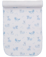 The Puppy Paws Printed Burp Cloth by Kissy Kissy features a charming pattern of illustrated puppies in various poses, small blue flowers, and adorable puppy paw prints. Crafted from soft Pima cotton, this white and blue burp cloth is finished with a rolled top edge.