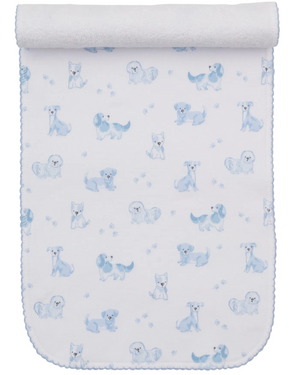 The Puppy Paws Printed Burp Cloth by Kissy Kissy features a charming pattern of illustrated puppies in various poses, small blue flowers, and adorable puppy paw prints. Crafted from soft Pima cotton, this white and blue burp cloth is finished with a rolled top edge.