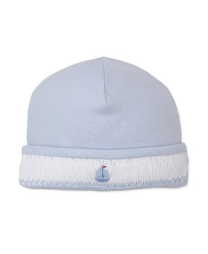Kissy Kissy Baby Boys’ CLB Summer Medley Smocked Hat in light blue, crafted from soft Pima cotton with a white cuff, features a delicate hand-embroidered sailboat design on the front.