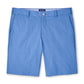The Peter Millar Surge Performance Short in light blue features belt loops, front pockets, a button closure, and four-way stretch fabric, shown on a white background.