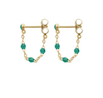 Explore the exquisite Gigi Clozeau Classic Gigi Earrings, showcasing gold studs with connecting chains and small green beads, a testament to Gigi Clozeau's jewelry artistry.