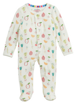 The Baby Kale Yeah Footie by Magnetic Me is a white sleeper adorned with colorful fruit and vegetable prints, made from sustainable modal for exceptional softness. It features long sleeves, closed feet, and easy magnetic closures down the front.