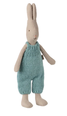 Cream Yellow Rabbit with Knitted Overall - Size 1 by Maileg, a stuffed rabbit toy standing upright and dressed in knit blue overalls.