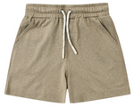 The Boys’ Oceanside Tech Short by Rylee & Cru, featuring a light brown elastic waistband, side pockets, drawstring closure, and a relaxed fit, is laid flat on a white background.