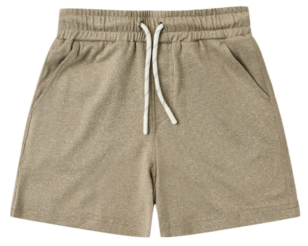 The Boys’ Oceanside Tech Short by Rylee & Cru, featuring a light brown elastic waistband, side pockets, drawstring closure, and a relaxed fit, is laid flat on a white background.