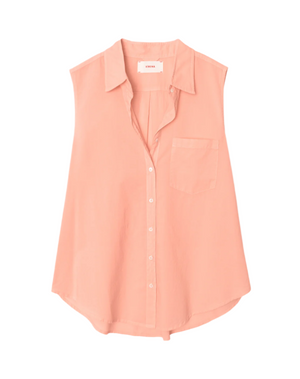 The Xirena Brooks Shirt is a sleeveless, light pink button-front top with a collar and single chest pocket, made from lightweight cotton poplin and featuring a high-low shirttail hem. Shown laid flat on a white background.