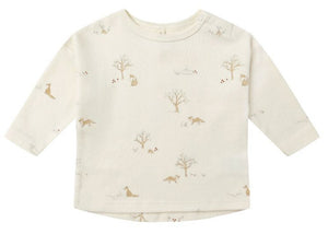 The Quincy Mae Baby Long Sleeve Tee is made from cream-colored organic brushed cotton and features all-over light brown animal and tree prints.
